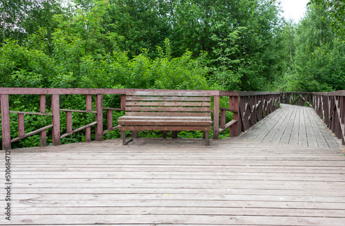 Wooden ecological path and a bench for rest.