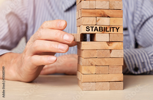 Concept of ruining balance and stability in business and economy. Unstable and instability. High quality photo photo