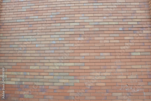 Beautiful brick wall background. Decorative facing brick. Modern finishing building materials.