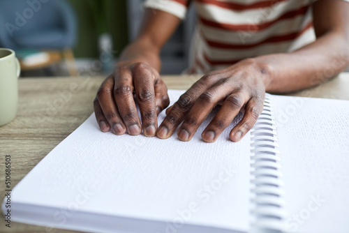 Εκτύπωση καμβά Closeup of blind African American man reading tactile book in braille, accessibl