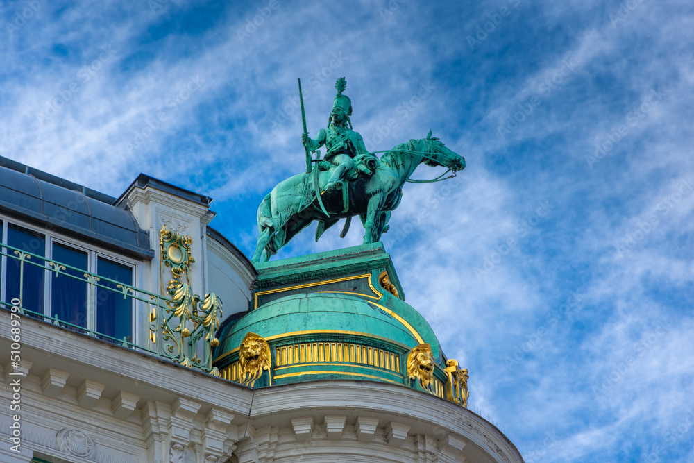 Obraz premium Old statue of a knight on the top of the Hofburg, Vienna, Austria