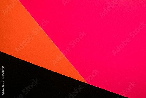 Colored cardboards background in red orange black tone. Color cardboard. Abstract Colorful Background. Modern material design. The texture of red paper