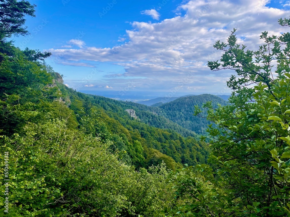 Fuchsfelsen belvedere, Wegscheid volcanoes and mountain and forest landscape with rocks in Alsace on a beautiful spring day Fuchsfelsen belvedere, Wegscheid volcanoes and mountain and forest landscape with rocks in Alsace on a beautiful spring day