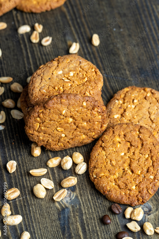 oatmeal cookies with peanuts on a black wooden table oatmeal cookies with peanuts on a black wooden table