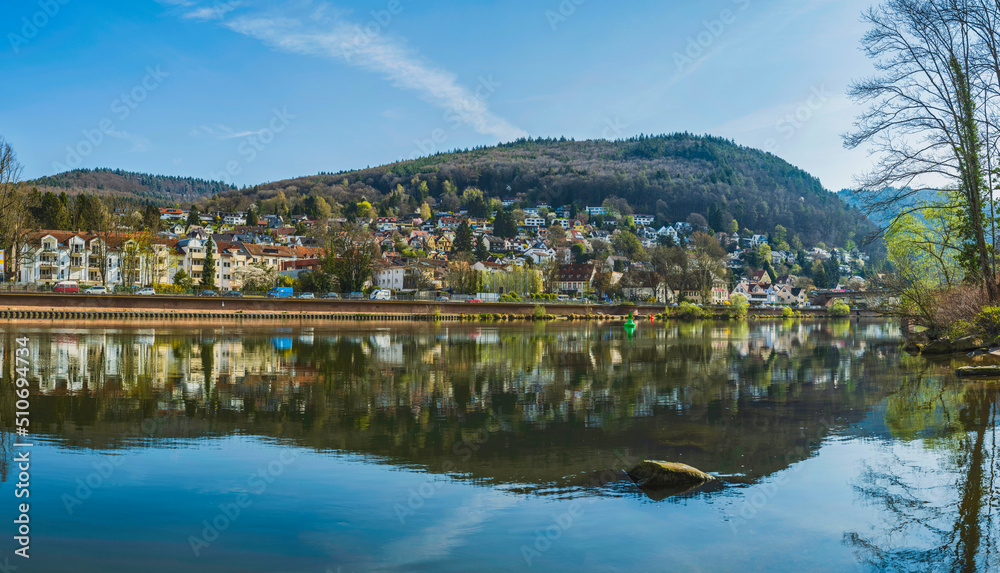 Panorama shot of Heidelberg river side houses reflection on Neckar river, Germany