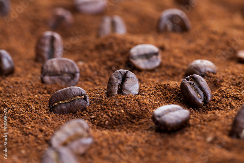 roasted coffee beans on the table , close up
