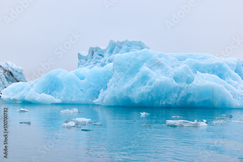 A blue iceberg in Iceland. A iceberg flowing into the Jokulsarlon lagoon  detached from the glacier s front.