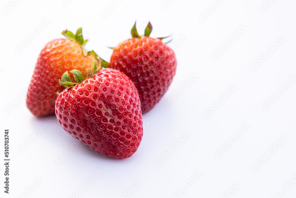 Three strawberries on white Three strawberries on white