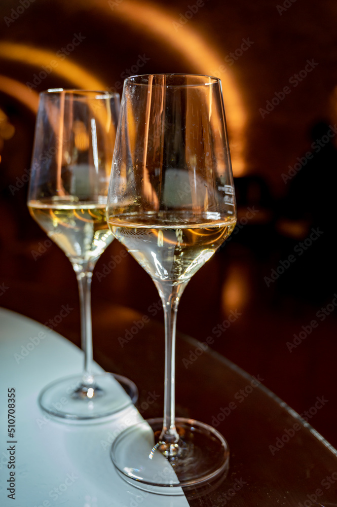 Tasting of brut champagne sparkling wine produced by traditional method in underground caves Tasting of brut champagne sparkling wine produced by traditional method in underground caves