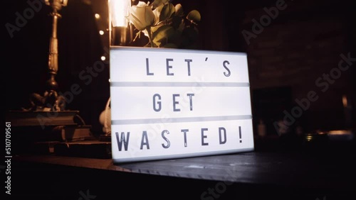 Wallpaper Mural Decorative Plaque with Inscription Lets Get Waisted on the Bar. Torontodigital.ca