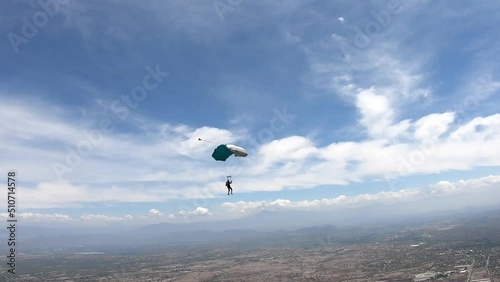 Skydiving. A solo parachute is flying in the sky.