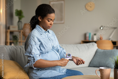 Sick Pregnant Black Woman Measuring Temperature Having Fever At Home