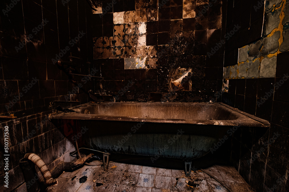 Burnt apartment house interior. Consequences of fire in bathroom