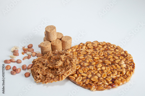 Paçoca, pé de moleque , cocada and peanut on a white background photo