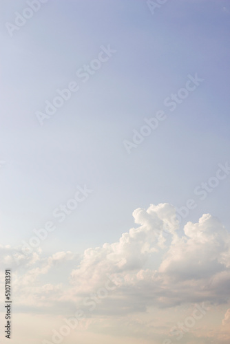 vertical image with blue evening sky and clouds
