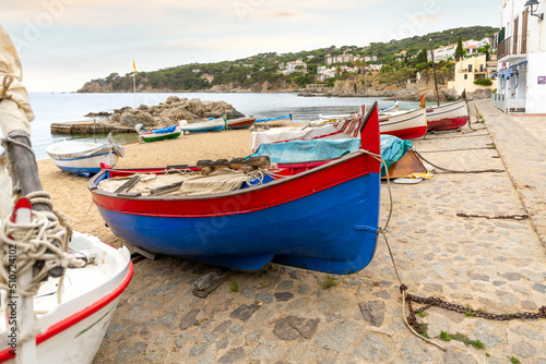 Fishing boats docked and moored on the sandy beach of the Spanish village of Calella de Palafrugell  Spain  on the Costa Brava coast.