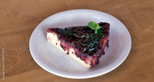 Slice of cheesecake with jam covered