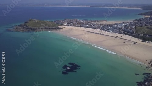 Aerial: Clear Celtic Sea water off Porthmeor Beach, St Ives, Cornwall photo