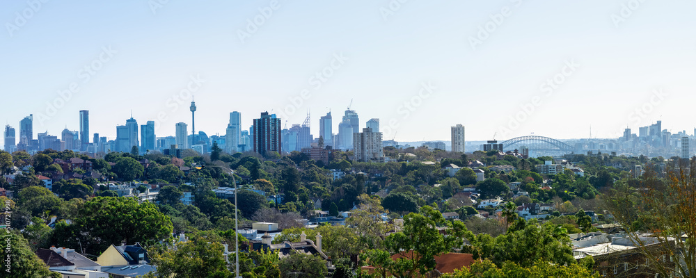 Panorama view of Sydney CBD and Sydney Harbour. Distant view of High-rise office towers and high-rise apartment buildings. Suburban Sydney Suburbs in the foreground NSW Australia  