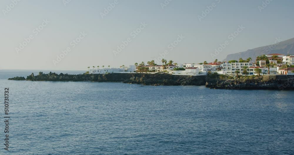 Tenerife, Canary Islands, Spain. Sunset. Beautiful and peaceful relax view of the coastline of the cute fishing town Alcala, rocky volcanic shore. Tenerife, Canary Islands, Spain. Sunset. Beautiful and peaceful relax view of the coastline of the cute fishing town Alcala, rocky volcanic shore.