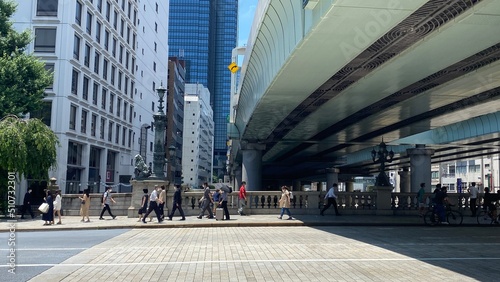 Tokyo city landscape / cityscape, Nihonbashi Tokyo Japan, the highway over the historic bridge, completed in 1911, the daily scenery of pedestrians and the surrounding buildings, shot taken on year 20 photo