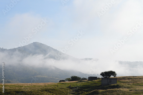 house under construction, landscape and sky photo