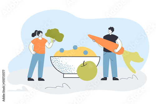 Tiny people holding vegetables for healthy diet. Man and woman cooking morning food flat vector illustration. Nutrition, breakfast meal, health concept for banner, website design or landing web page