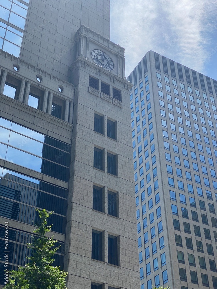 Obraz premium The glass architectural closeup of central downtown Tokyo modern buildings, year 2022 June 13th, sunny weekeday