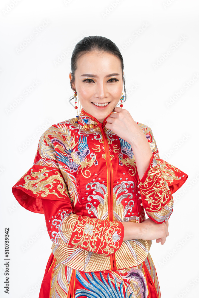 Portrait of a young asian Chinese female lady model wearing red traditional vintage wedding dress costume smiling and posing with different poses and gestures Portrait of a young asian Chinese female lady model wearing red traditional vintage wedding dress costume smiling and posing with different poses and gestures