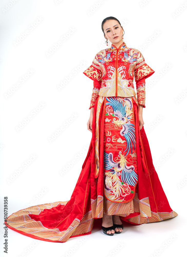Portrait of a young asian Chinese female lady model wearing red traditional vintage wedding dress costume smiling and posing with different poses and gestures Portrait of a young asian Chinese female lady model wearing red traditional vintage wedding dress costume smiling and posing with different poses and gestures
