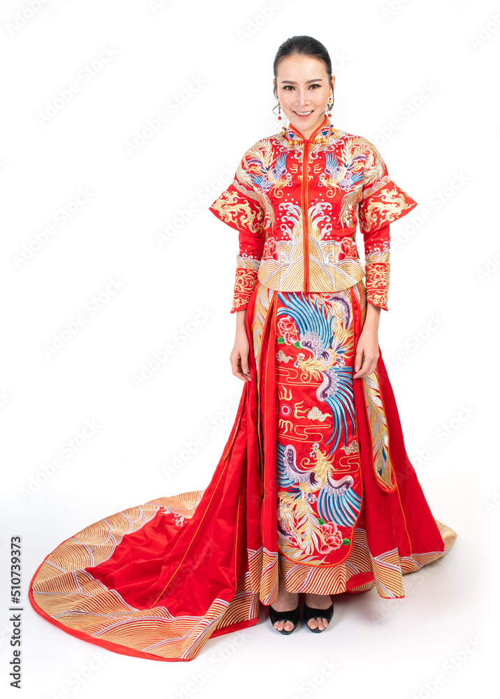 Portrait of a young asian Chinese female lady model wearing red traditional vintage wedding dress costume smiling and posing with different poses and gestures Portrait of a young asian Chinese female lady model wearing red traditional vintage wedding dress costume smiling and posing with different poses and gestures