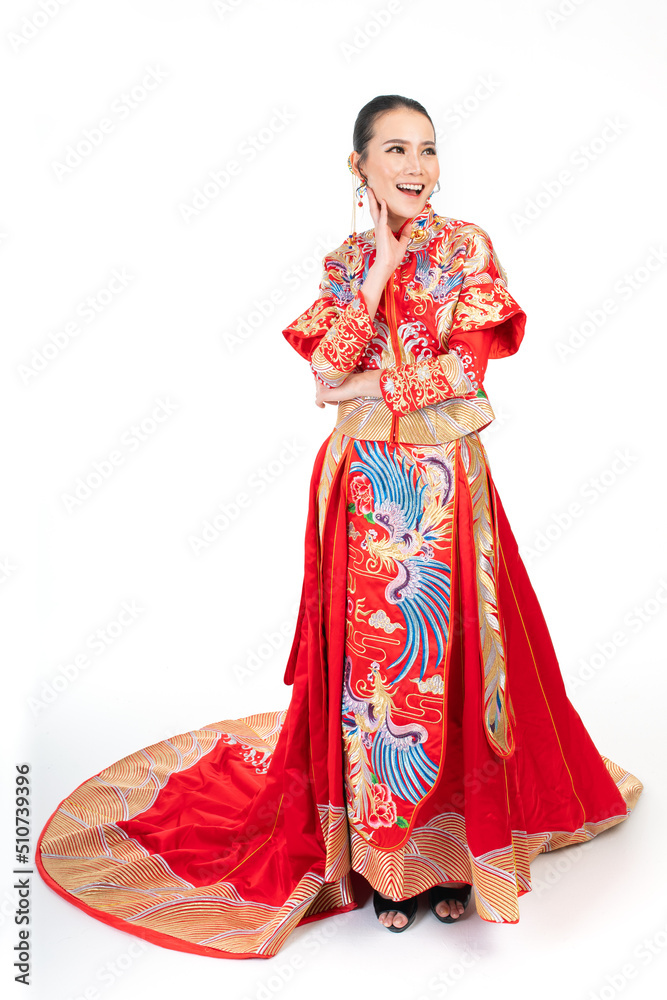 Portrait of a young asian Chinese female lady model wearing red traditional vintage wedding dress costume smiling and posing with different poses and gestures Portrait of a young asian Chinese female lady model wearing red traditional vintage wedding dress costume smiling and posing with different poses and gestures