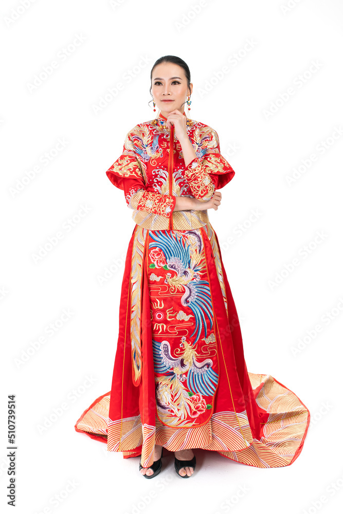 Portrait of a young asian Chinese female lady model wearing red traditional vintage wedding dress costume smiling and posing with different poses and gestures Portrait of a young asian Chinese female lady model wearing red traditional vintage wedding dress costume smiling and posing with different poses and gestures