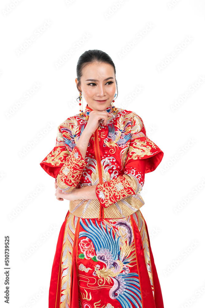 Portrait of a young asian Chinese female lady model wearing red traditional vintage wedding dress costume smiling and posing with different poses and gestures Portrait of a young asian Chinese female lady model wearing red traditional vintage wedding dress costume smiling and posing with different poses and gestures