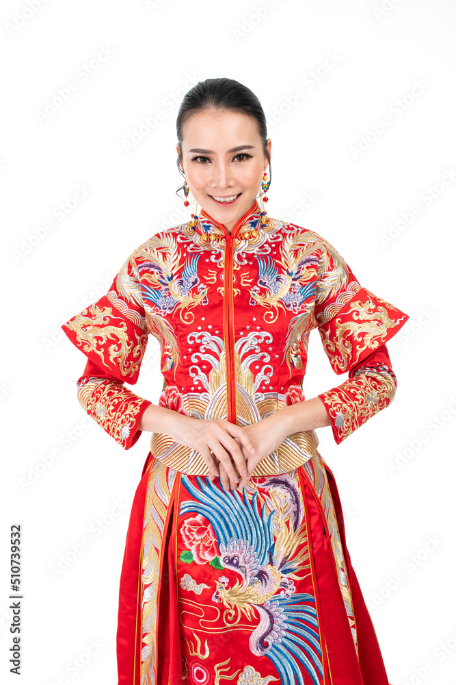 Portrait of a young asian Chinese female lady model wearing red traditional vintage wedding dress costume smiling and posing with different poses and gestures 