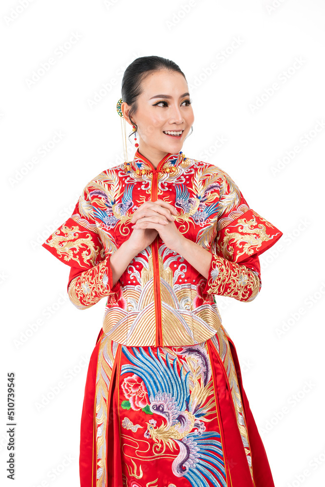 Portrait of a young asian Chinese female lady model wearing red traditional vintage wedding dress costume smiling and posing with different poses and gestures Portrait of a young asian Chinese female lady model wearing red traditional vintage wedding dress costume smiling and posing with different poses and gestures