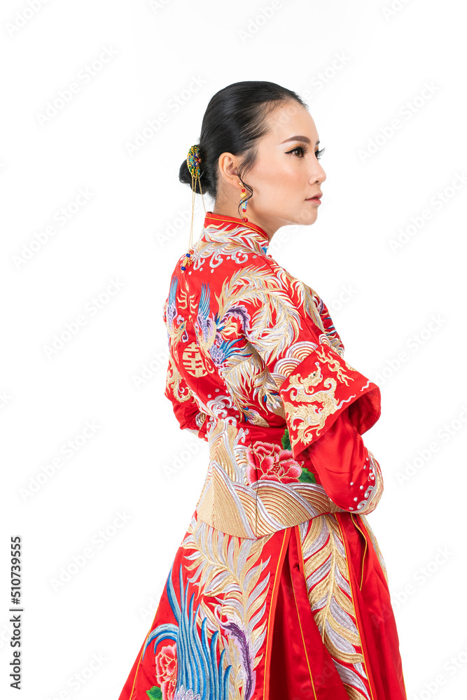 Portrait of a young asian Chinese female lady model wearing red traditional vintage wedding dress costume smiling and posing with different poses and gestures 