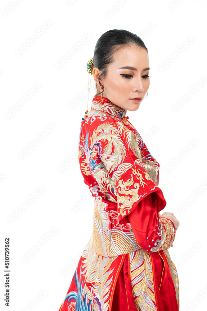 Portrait of a young asian Chinese female lady model wearing red traditional vintage wedding dress costume smiling and posing with different poses and gestures Portrait of a young asian Chinese female lady model wearing red traditional vintage wedding dress costume smiling and posing with different poses and gestures