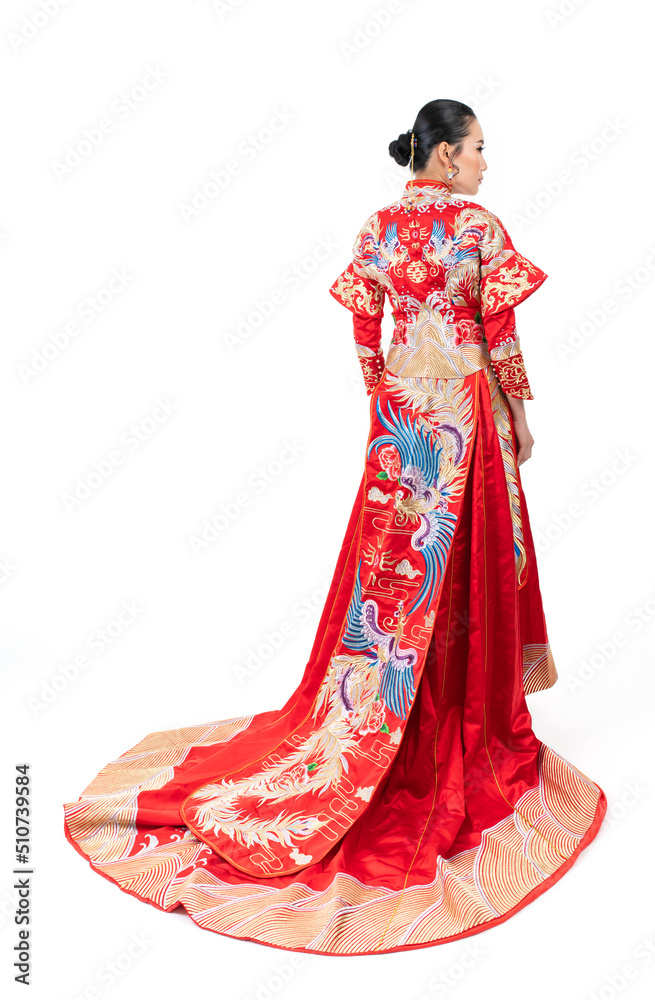 Portrait of a young asian Chinese female lady model wearing red traditional vintage wedding dress costume smiling and posing with different poses and gestures Portrait of a young asian Chinese female lady model wearing red traditional vintage wedding dress costume smiling and posing with different poses and gestures