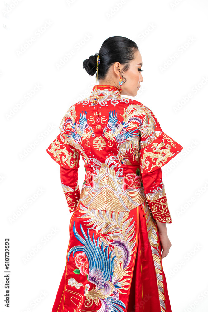 Portrait of a young asian Chinese female lady model wearing red traditional vintage wedding dress costume smiling and posing with different poses and gestures 