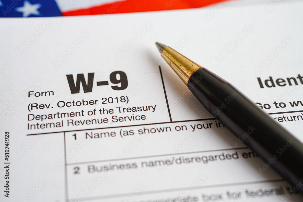Tax form W-9 Request for Taxpayer Identification Number and Certification, business finance concept. Tax form W-9 Request for Taxpayer Identification Number and Certification, business finance concept.