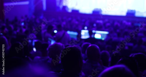 Audience listens to the lecturer at the conference hall. Partnership occupation of business people. Modern learning.