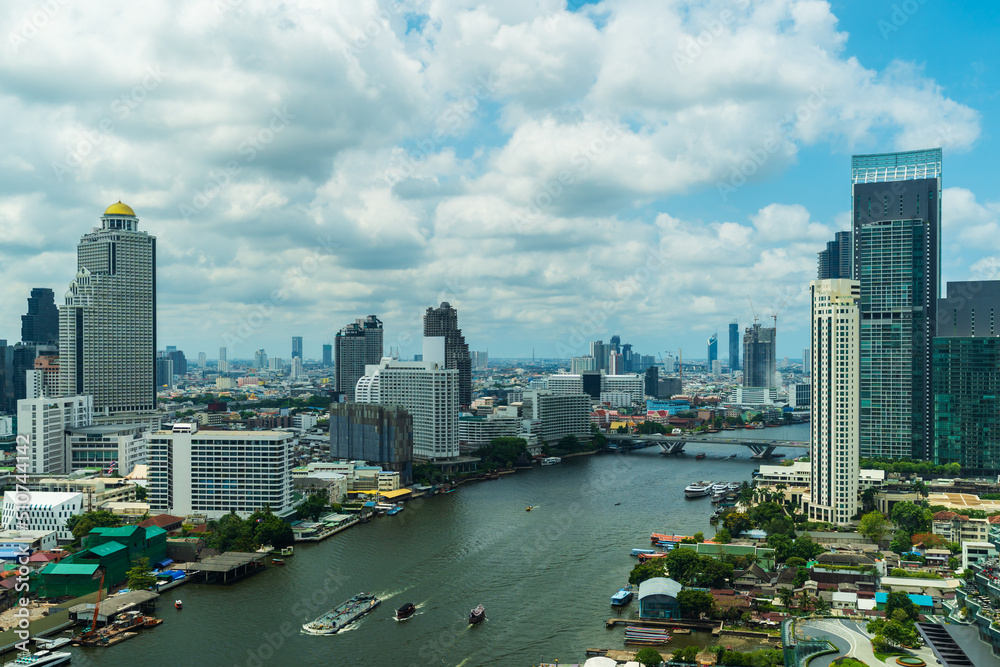 Fototapeta premium Chao Phraya River with Taksin bridge and building of Bangkok city, Thailand