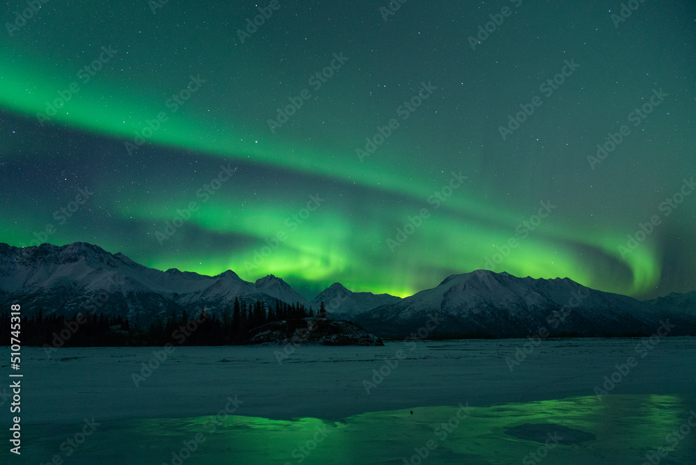 Aurora sky in Alaska with strong Northern Lights
