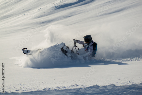 Snowmachine rider in Alaska backcountry