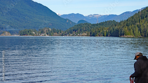 Burrard Inlet as seen from Inlet Park at Burnaby, BC, with forested mountain backdrop.