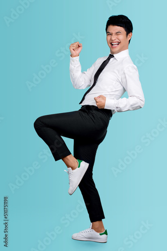 Full length body size view of attractive successful cheerful guy dancing having fun celebrating victory isolated over blue pastel color background