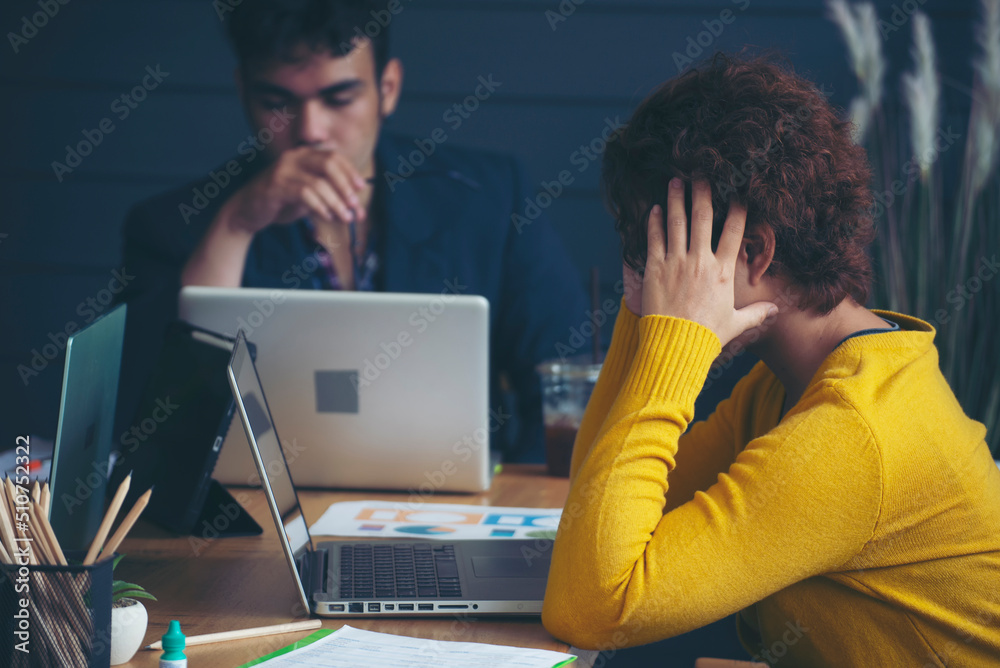 Stressed businesspeople, Frustrated and upset in business pressure and overworked at office. Adult Asian man and woman working on laptop, feeling tire and headache. Stressed and Frustrated concept. Stressed businesspeople, Frustrated and upset in business pressure and overworked at office. Adult Asian man and woman working on laptop, feeling tire and headache. Stressed and Frustrated concept.