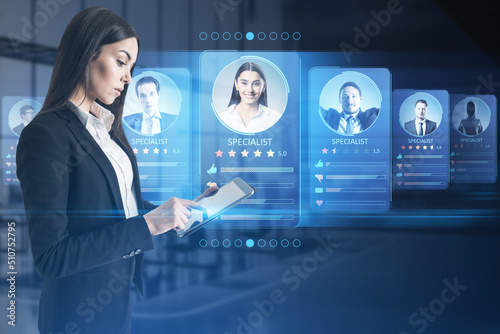 Employee data recruitment and marketplace for search specialists or professional online with young woman using digital tablet on virtual screen background with candidate personal information