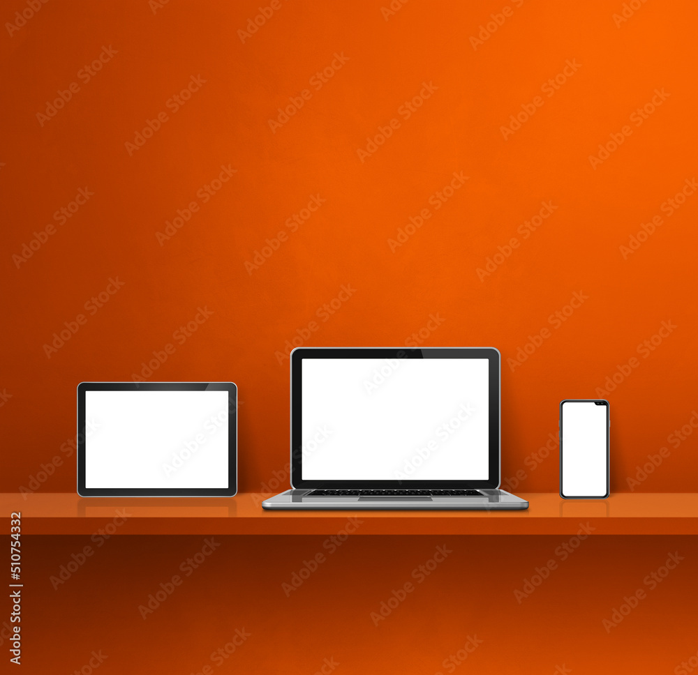 Laptop, mobile phone and digital tablet pc on orange wall shelf. Square background Laptop, mobile phone and digital tablet pc on orange wall shelf. Square background